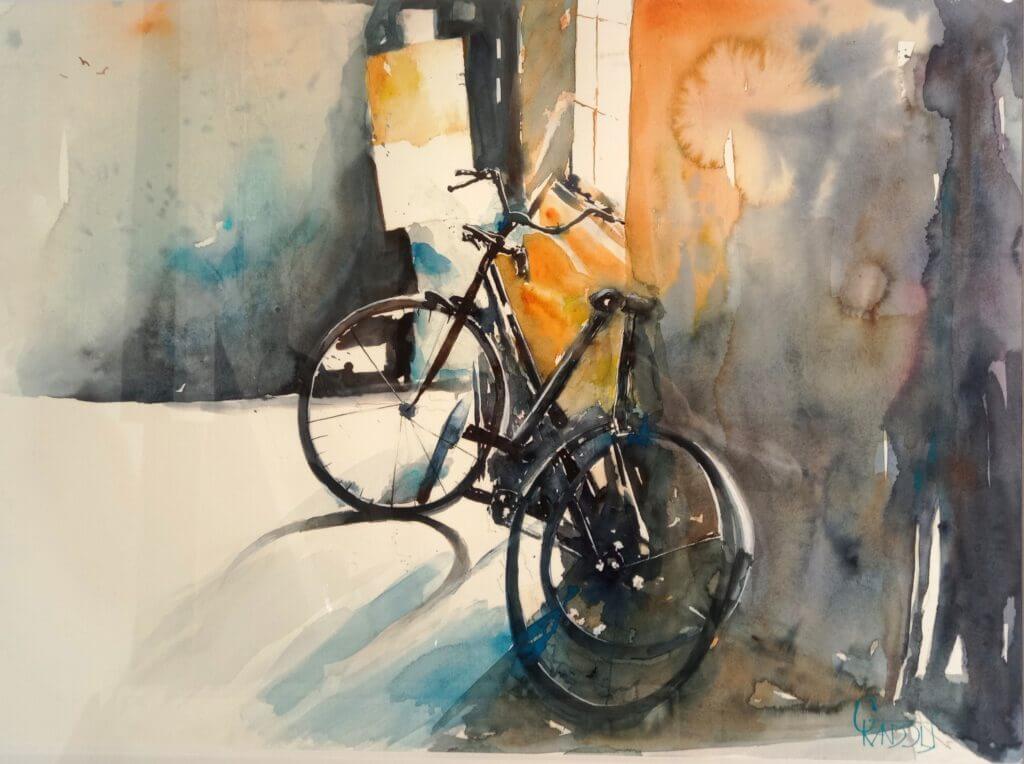 Schwarzes Fahrrad in Aquarell, umgeben von sanften Farben und Lichtspielen.