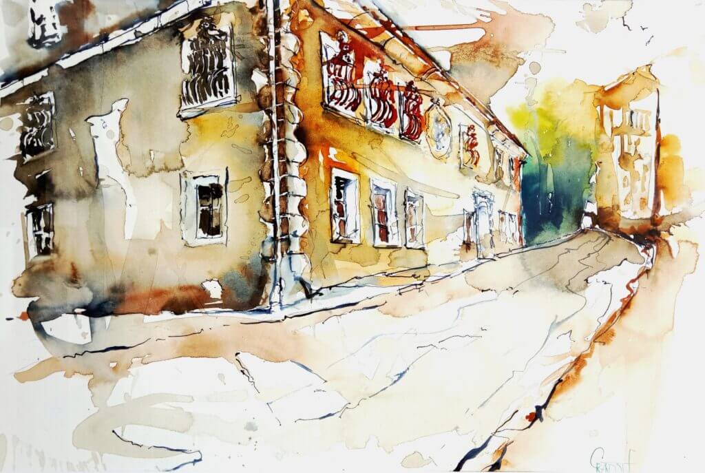 Blick auf ein charmantes, rustikales Gebäude in einer malerischen Straßenansicht.